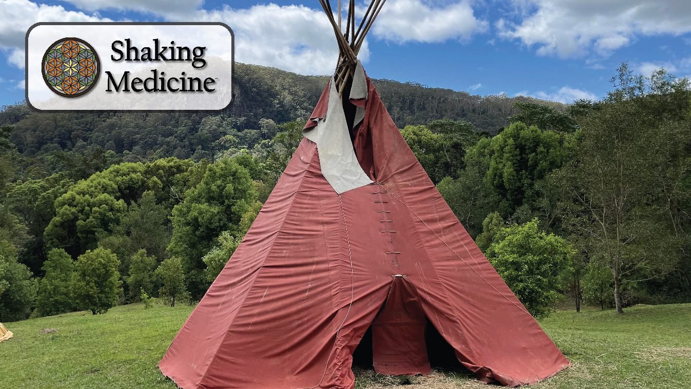 A red tipi in a green valley, with the Shaking Medicine mark