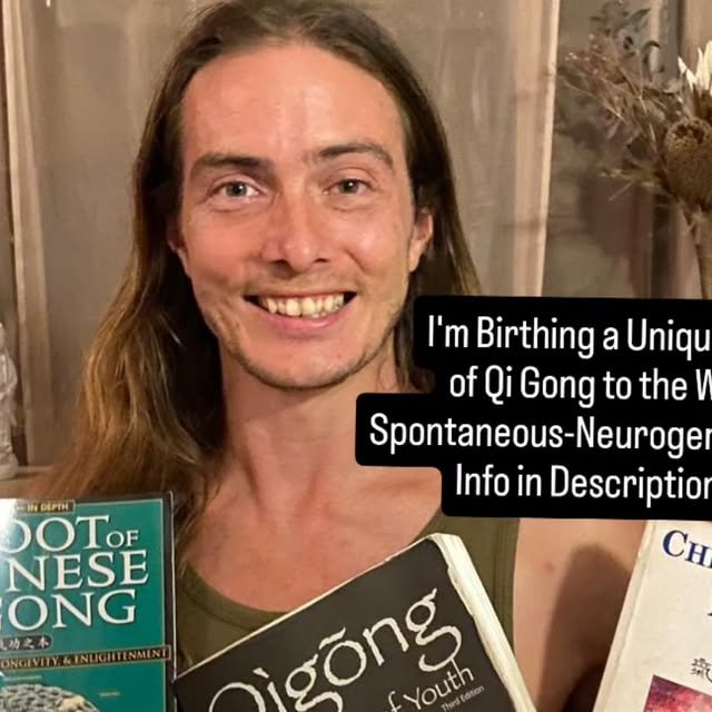 Keith holding books on Qi Gong